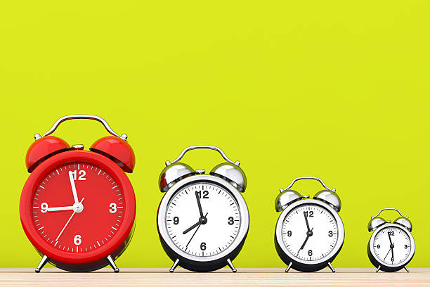 istock Vintage Alarm Clocks with Single Red One.  3d Rendering 597646926