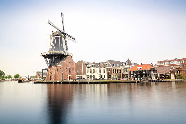 istock Haarlem by a canal with windmill, The Netherlands 597647594