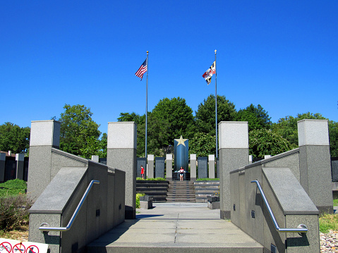 Annapolis, Maryland, USA - August 23, 2016: The World War II Memorial is dedicated to the American military men and women who lost their lives in World War II.  The Memorial is located in the median of Route 450 on a hill overlooking Annapolis, the Severn River, and the United States Naval Academy.   Annapolis is a historic waterfront town on the east coast of the USA on the Severn River, a tributary of the Chesapeake Bay.  Annapolis Harbor and  Annapolis City Dock are nearby. 