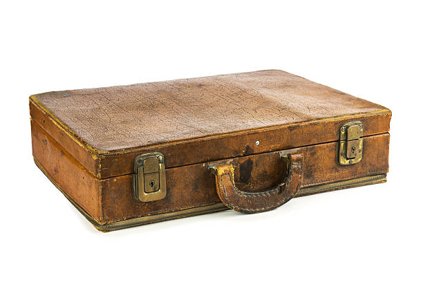 istock Old vintage suitcase isolated on white background 597651384