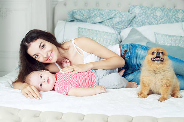 istock mother and baby in bed 597651972