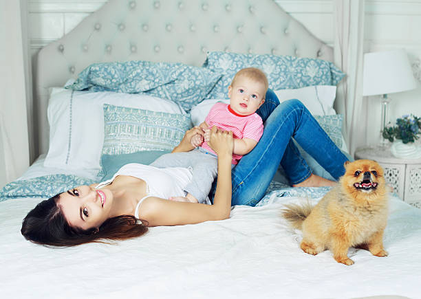 istock mother and baby in bed 597652038