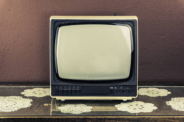 istock Old retro TV on vintage table, brown background 597652658