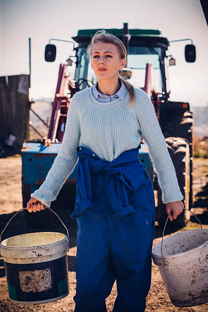 istock Girl Working Hard on the Farm 597653808