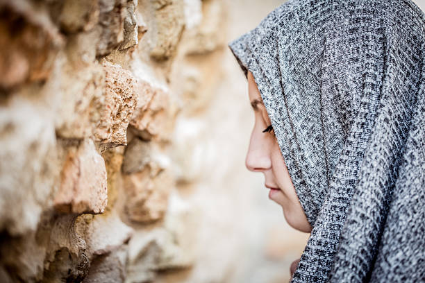 istock Young Woman Praying 597657464
