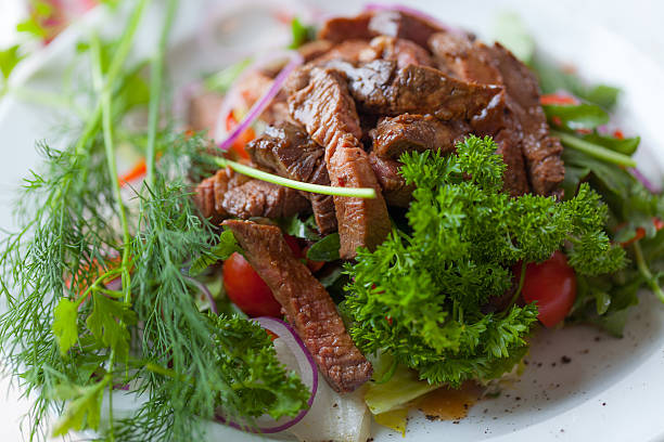 istock Beef stroganoff with fresh vegetables and herbs, Uglich, Russia 597658058