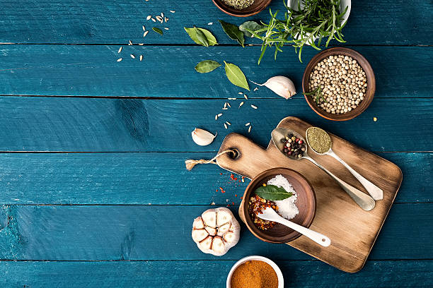 istock culinary background with spices on wooden table 597658592