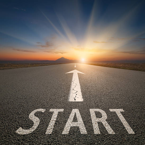 istock Success concept on open road with start text at sunset 597659124