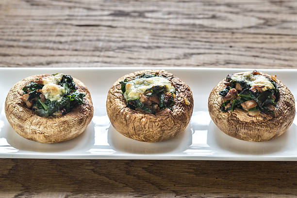 istock Baked mushrooms stuffed with spinach and cheese 597659798