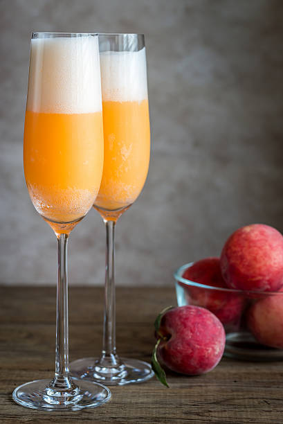 istock Two bellini cocktails with fresh peaches 597659848