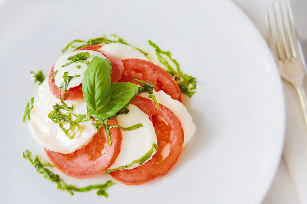istock Tomato and Mozzarella Salad with Basil and Olive Oil 597660436