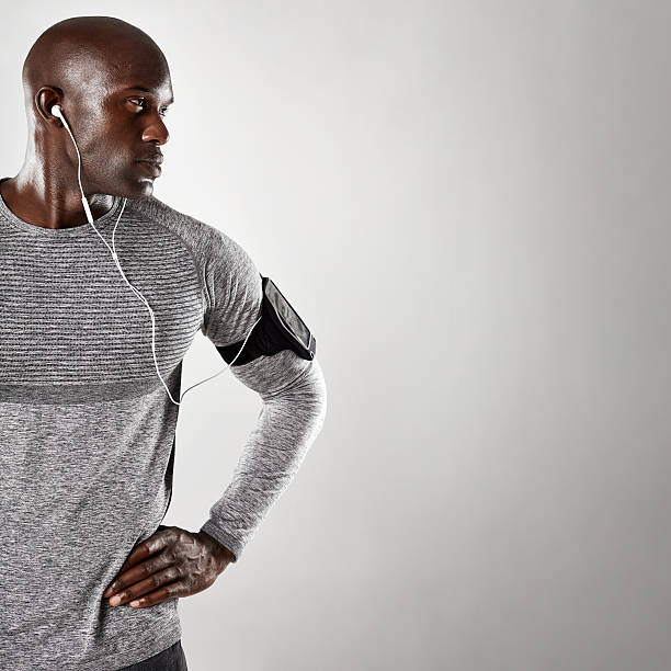 istock African male model with earphone looking at copy space 597661414