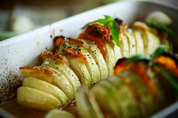 istock Baked zucchini stuffed with vegetables 597662190