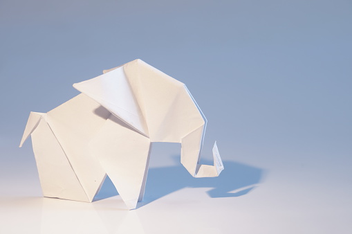 Paper elephant isolated on white background. Origami elephant.