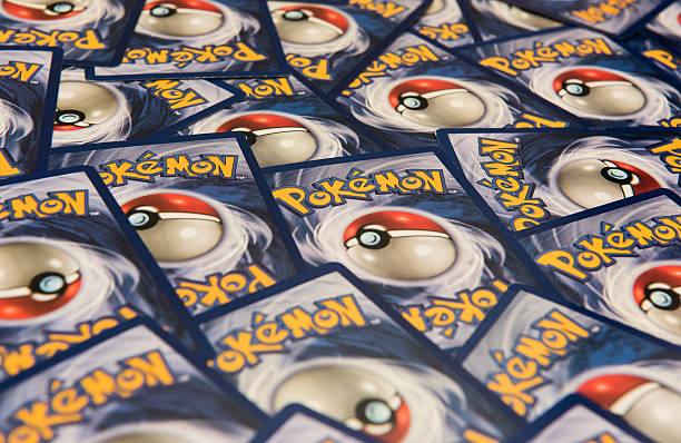 Pokemon trading cards background New York City, NY, USA - July 12, 2016: Pokemon trading cards background. Illustrative Editorial playing card stock pictures, royalty-free photos & images