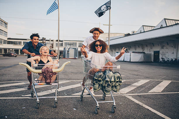 istock Friends racing with shopping cart 597665178