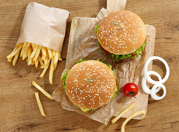 istock Cheeseburgers with fries 597665216