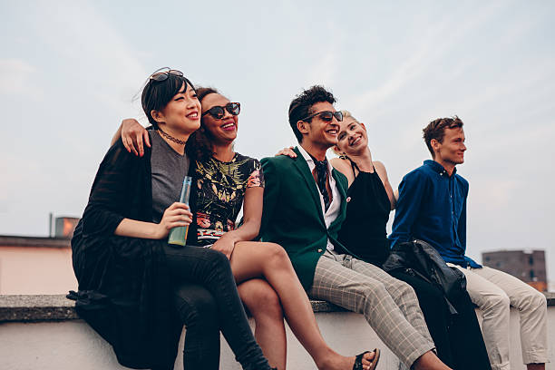 istock Friends hanging out together on rooftop 597666124