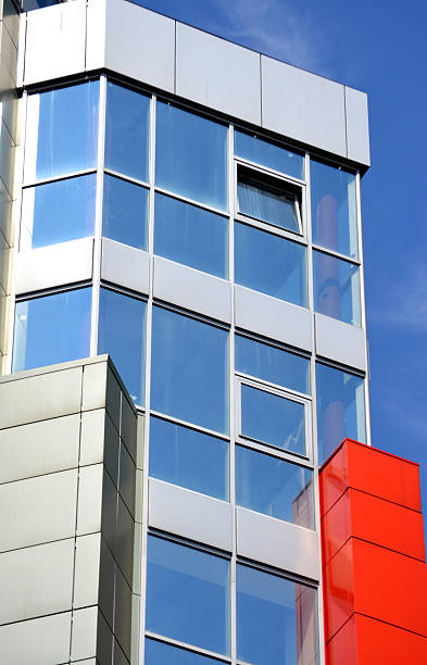 istock mirrored glass windows of the new building 597667312