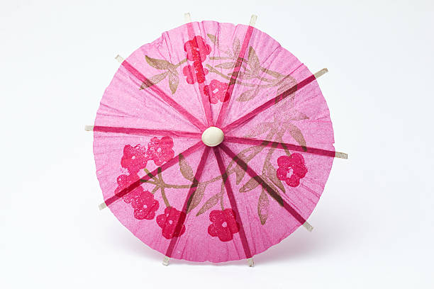 istock Cocktail umbrella on a white background. 597668116