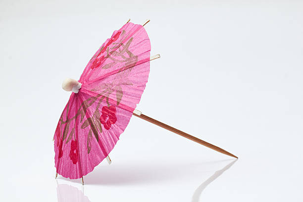 istock Cocktail umbrella on a white background. 597668154