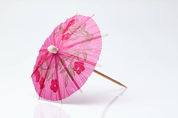 istock Cocktail umbrella on a white background. 597668198