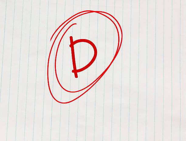 istock D grade written in red on notebook paper 597668206