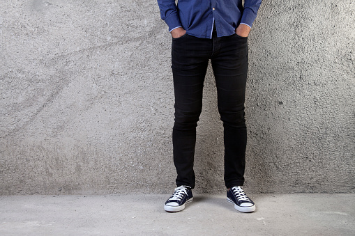 Young man standing on a concrete floor