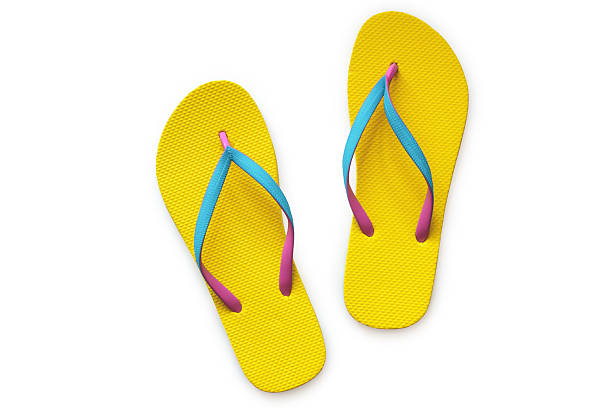 Yellow flip flops isolated on white background Yellow flip flops isolated on white background. Top view attraction studio photography stock pictures, royalty-free photos & images