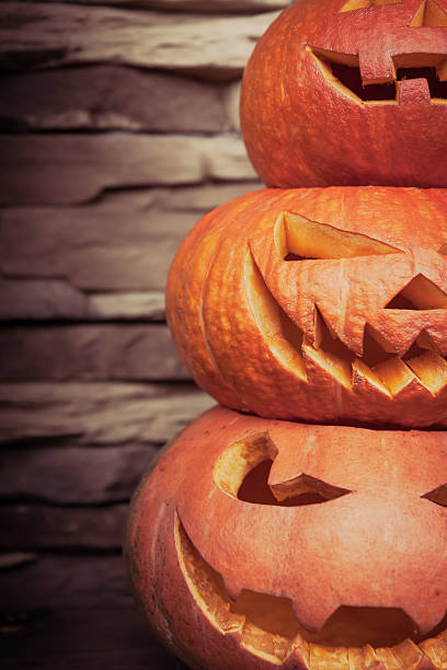 Stack of halloween jack o lanterns in vertical orientation