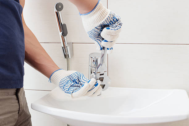 istock Closeup man fixing sink in a bathroom 597672558
