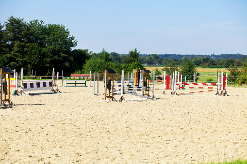 Mülheim, Germany - August 23, 2016: Show jumping course in valley Ruhr in summer. Course is near riding farm in outskirts of Mintard. View from pathway through fields passing grounds.