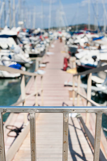 istock Closed steel gate to access sailing boats 597675220