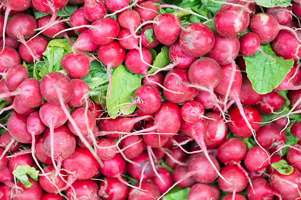 istock Red radish on market stall 597676282