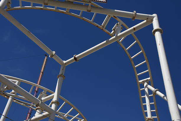 istock Low Angle View Of Rollercoaster Against Clear Blue Sky 597706645