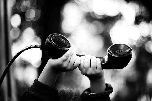 Boy child talking on vintage phone