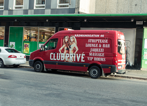 Stockholm, Sweden - October 1, 2015: Club Prevé escort  van parked in front of a grocery store