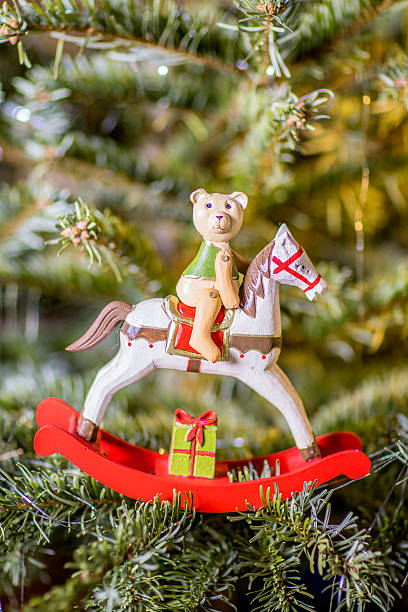 istock Rocking Horse on Christmas Tree 597928134