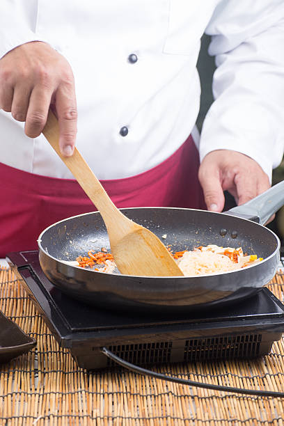 istock Chef stir fried rice noodle for cooking Pad Thai 597928286