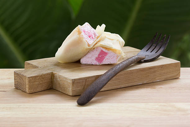 istock Crepes on wood plate 597929006