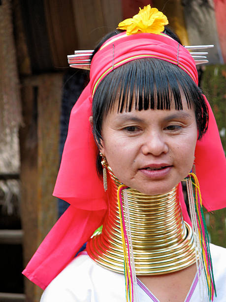 Twenty Neck Rings Chiang Rai, Thailand-January 12, 2010: A woman of the Kayan Lahwi Tribe, from a small village near Chiang Rai, proudly wears the traditional neck rings. Twenty rings are shown here. kayan neck rings stock pictures, royalty-free photos & images