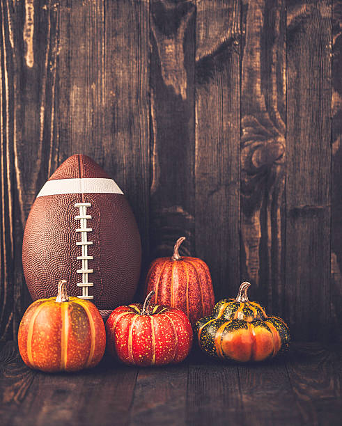 istock American football with assorted pumpkins 597931552
