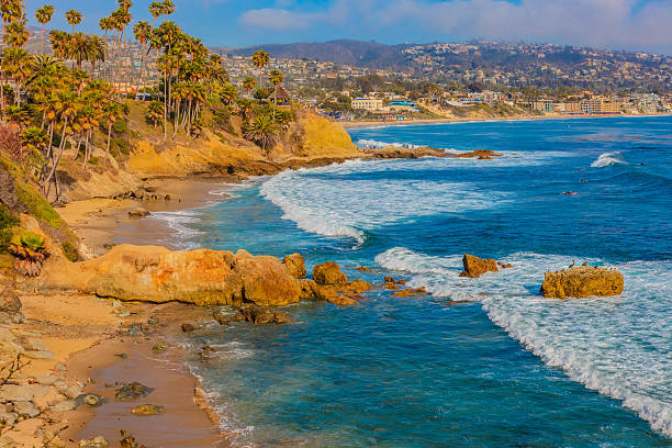 istock Laguna Beach coastline with palm trees and cliffs, CA 597932218