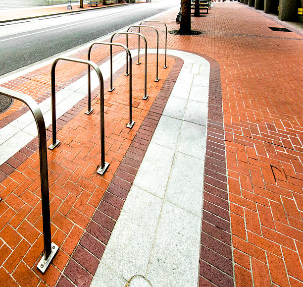 istock Modern Bike Rack, Downtown, Desolated Brick Sidesalk, Single Point Perspective 597932688