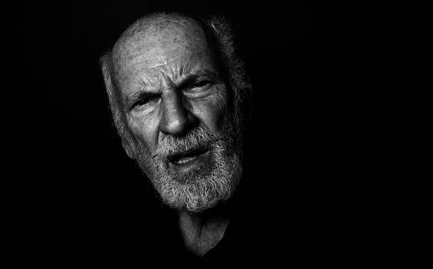 istock Confused Old Guy, Desaturated Low-Key Grunge Senior Man, Gothic Style 597932832