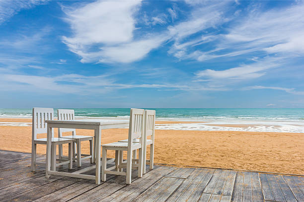 istock wood floor and seaside table with beach and sea background 597933138