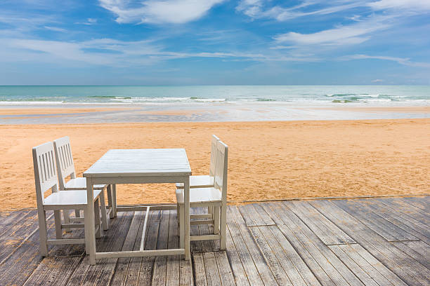 istock wood floor and seaside table with beach and sea background 597933164