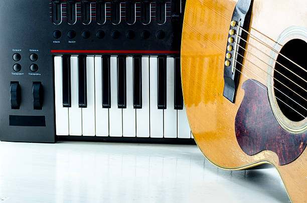 istock Acoustic guitar keyboard close-up. 597933934