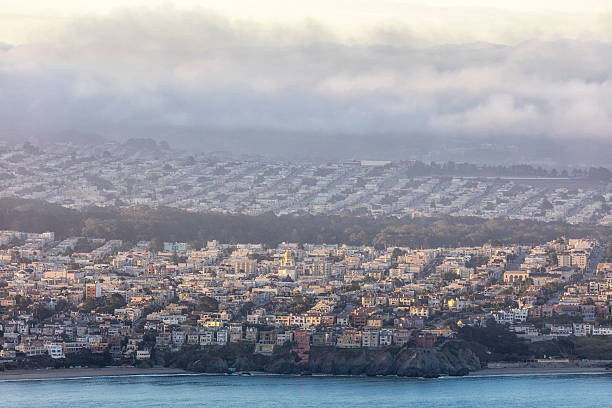 Residential Area On the West Side of San Francisco Early morning fog blankets the Background, Golden Gate Park on the background. west marin stock pictures, royalty-free photos & images