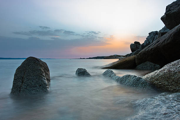 istock Sea rocks on sandy beach at sunset in Sithonia, Chalkidiki 597939784
